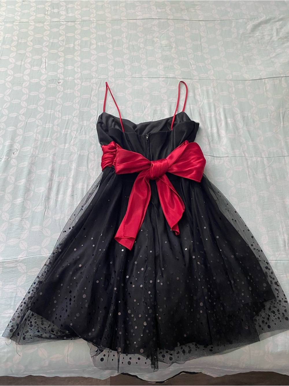 B. Smart Black Tulle Dress with Red Bow Accent